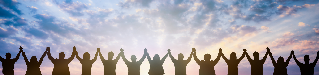 People holding hands with their arms raised