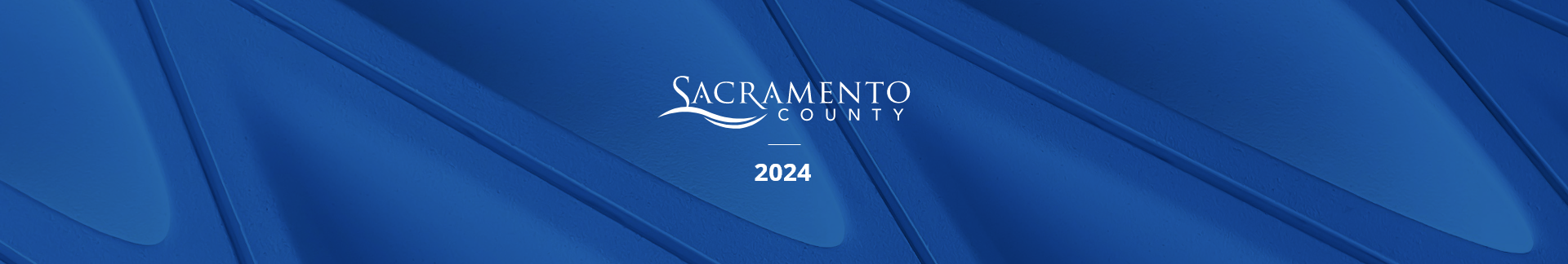 County logo and the year 2024 on a textured, blue background 